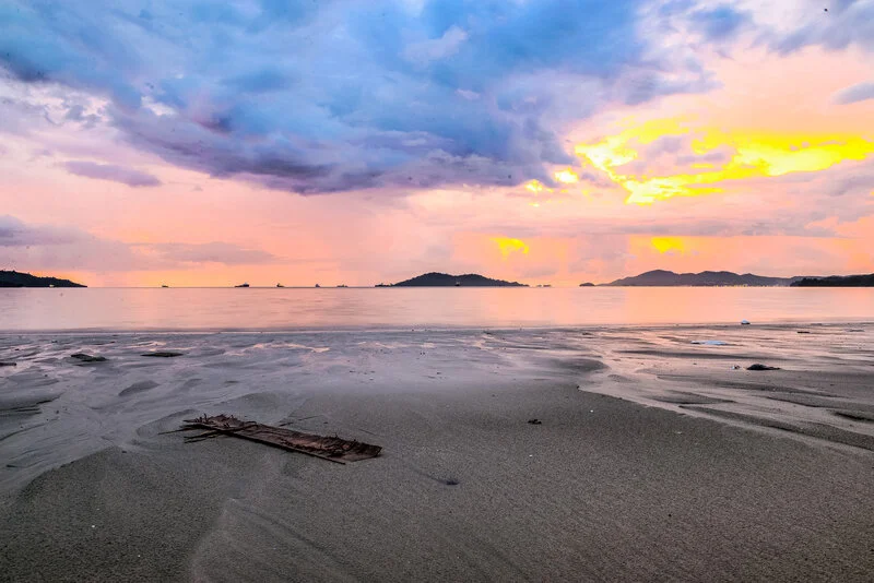 Quiet beach at sunset with pastel sky